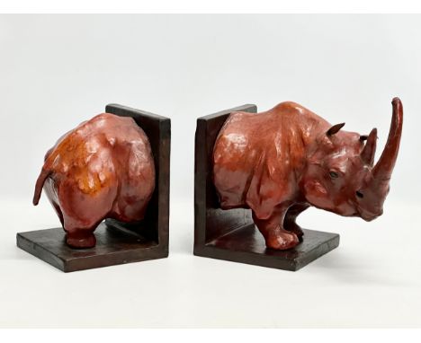 A pair of large vintage leather rhino bookends. Head end measures 30x17x27cm