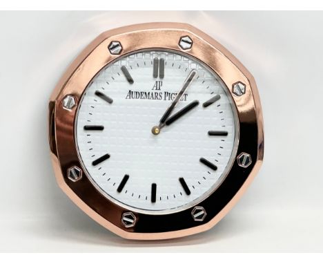 An AP Audemars Piguet adverting wall clock. 34cm