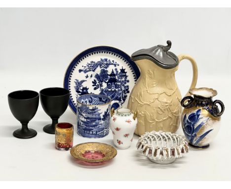 A collection of pottery and glass. A Moser Glass gilt cranberry liqueur glass and saucer, Wedgwood coffee can and saucer. A p
