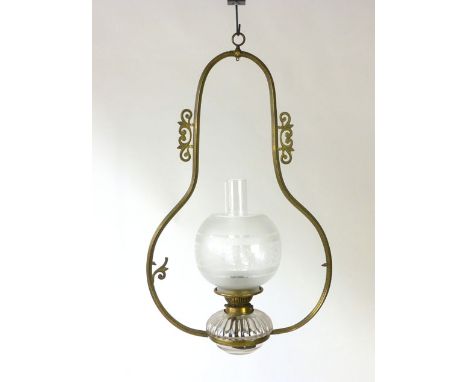 A Hinks and Son patent 19th century cottage oil burning lamp with frosted spherical shade, clear chimney and scrolled foliate