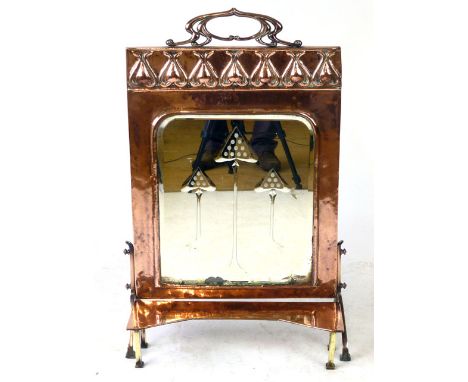 An Art Nouveau copper and mirrored fire screen with separate ledge, stylized handle above a row of flower heads, h. 82 cm   C