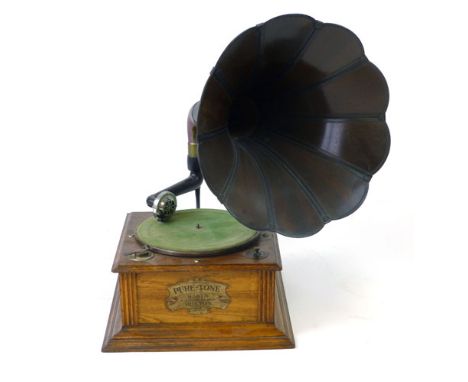 An oak cased Harts Pure-Tone gramophone with a flower-shaped horn, extra  HMV needle and a tin of further needles, d. 38 cm (