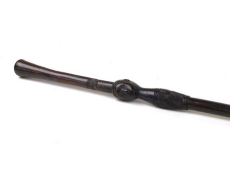 Tribal Art: a Zulu hardwood walking stick with warrior head carved decoration and notched design 
