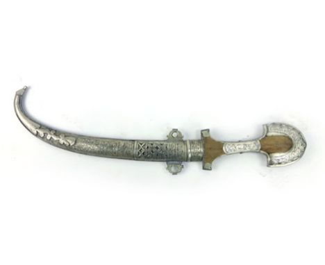 A eastern Jambiya dagger with a slightly curved blade and wooden handle, white metal and brass scabbard, blade l. 22 cm