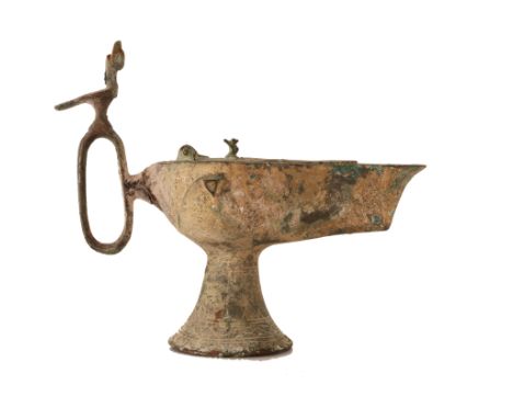  A bronze oil lamp  Iran, 12th century . Cm 16,00 x 14,00. 