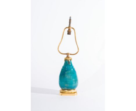 A turquoise glazed pottery vase with gilt bronze lamp mount Iran, Kashan, 12th century. European mount . Cm 52,50. 