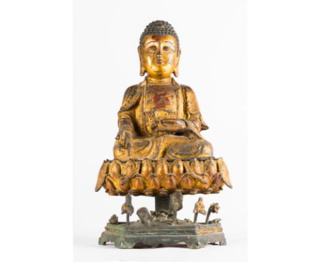  A rare, massive, gilt lacquered bronze statue of the symbolic tantric Buddha Ratnasambhava China, late Ming dynasty, 16th - 