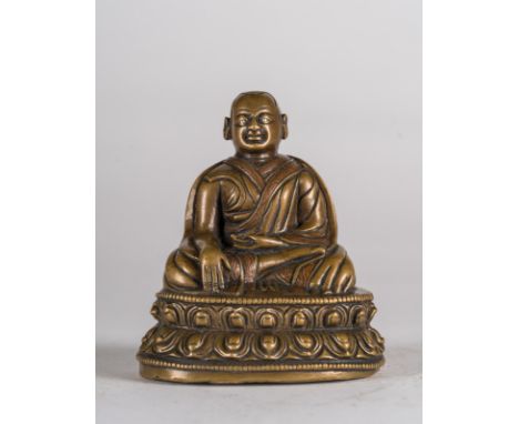  A Lama bronze figure  Tibet, 14th century . Cm 8,00 x 9,30. 