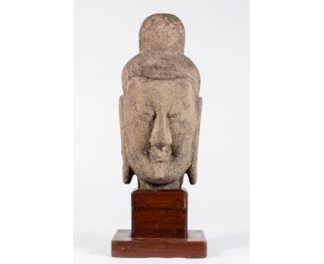  A stone sculpture of a head of Buddha in the Longmen style China, Northern Wei dynasty, 4th - 6th century . In the style of 