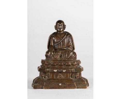  A Lama bronze figure  Tibet, 13th century or later . Cm 11,80 x 13,50. 