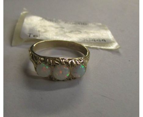 A 3 stone opal ring set in 9ct yellow gold.