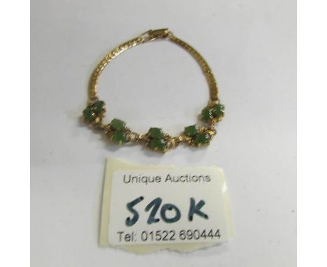 A 14 ct gold 6.8 gram jade bracelet.