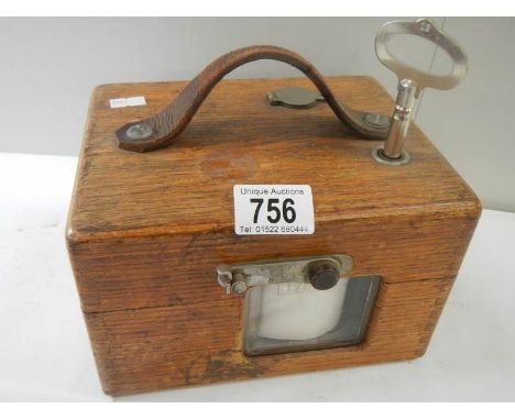 A mid 20th century oak cased pigeon clock.