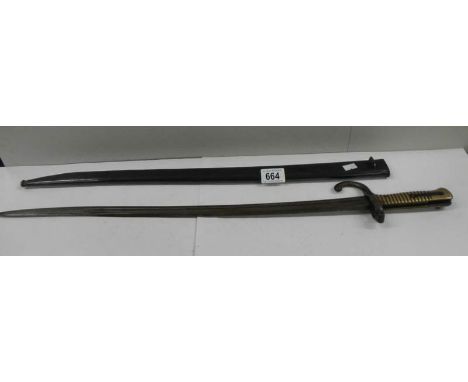A long French bayonet in original scabbard (70 cm / 27.5" long).