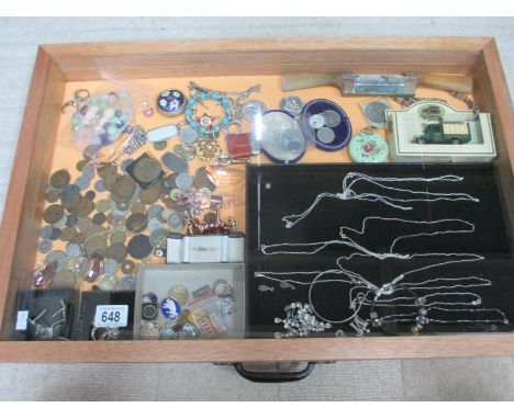 A display case containing assorted coins, silver pendants and other jewellery etc., (this lot is buyer collect only). ****Con