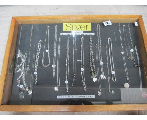 A display case of mainly silver pendants, chains etc., (this lot is buyer collect only). ****Condition report**** Outside siz