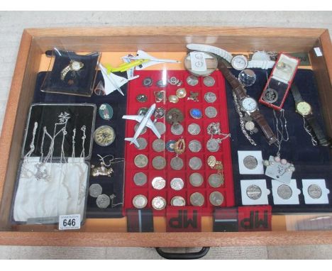 A display case containing silver chains, assorted coins, model aircraft, watches, cloth badges etc. (this lot is buyer collec