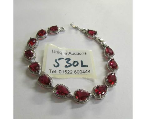 A silver garnet bracelet.