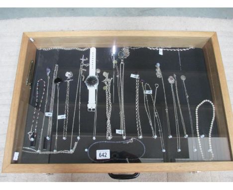 A display case of mainly silver pendants, bracelets and chains, (this lot is buyer collect only). ****Condition report**** Ou