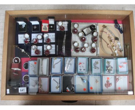A display case of approximately 40 pieces of mainly silver jewellery including pendants, rings, earrings etc and 6 ladies wri