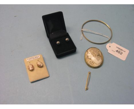 A 9ct. gold bangle, with metal core, cameo brooch in 9ct. gold mount, pair of cameo ear-rings, pair of 18ct. white gold-mount