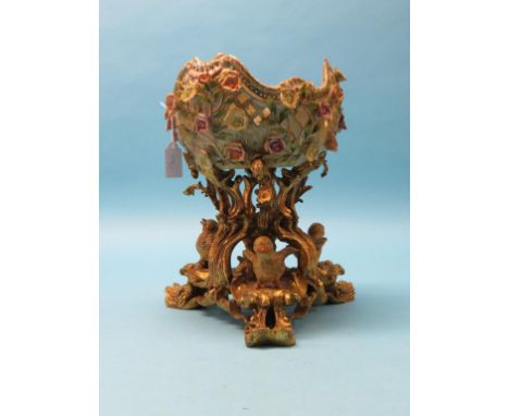 A German porcelain centrepiece, bowl encrusted with coloured flowers, on gilt-scroll tripod base with three chicks, 14in. hig
