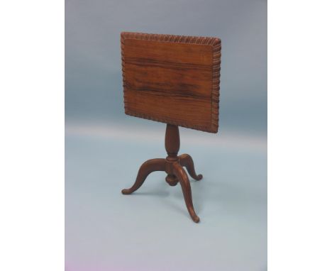 A rosewood tripod table, with rectangular tilt-top, gadroon borders, top 1ft. 9in. wide