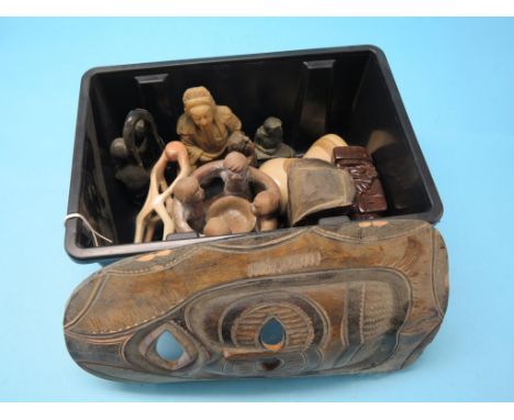 An African carved wood portrait mask, 16in. and a group of African/Eastern carvings 
