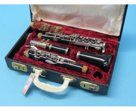A Boosey & Hawkes clarinet, in original case, together with a Bonelli piano accordion and a banjo