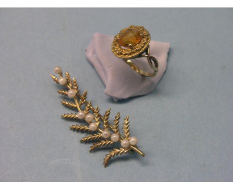 A 9ct. gold leaf-brooch, set pearl-type stones together with a 9ct. gold and citrine dress ring 