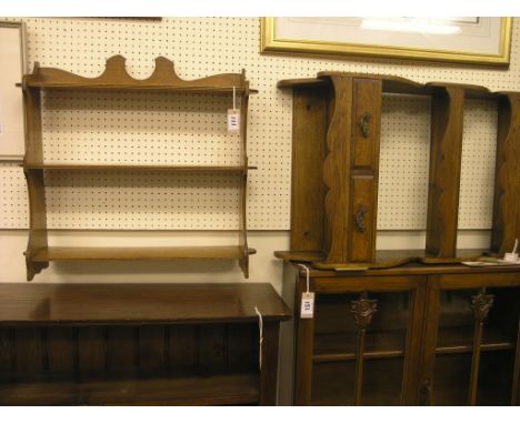 A solid, dark oak shelf unit, with two drawers, 1ft. 8in. and a smaller oak range of three shelves