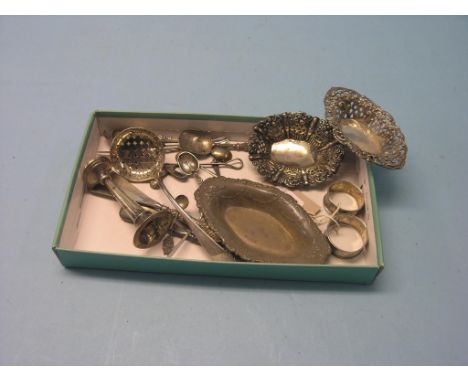 Small silverware, to include a Georgian sifter spoon, an engraved caddy spoon and three embossed dishes 