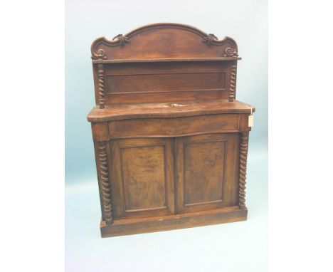 A Victorian walnut chiffonier, raised over-shelf above serpentine-fronted cupboard base with single drawer, barley-twist colu