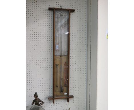 An Admiral Fitzroy barometer, with printed register plate, in glazed oak case, 39in.