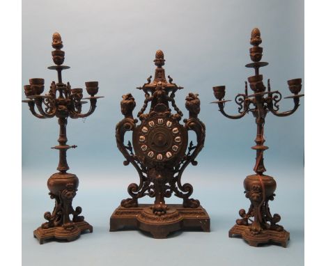 A 19th century bronze clock garniture, cast in neo-classical style, French bell-striking movement, candlesticks with four scr