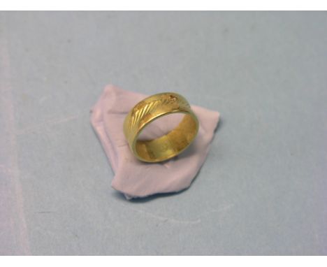 A 22ct. gold band wedding ring, 5 grams