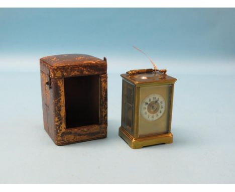 A late 19th century French mantel clock, with enamelled chapter ring, 8-day movement striking on a gong, with key, 7in., port