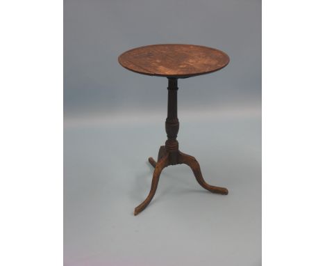 A Georgian provincial oak tripod table, circular dished top on turned stem, circa 1780, top 1ft. 8in. 
