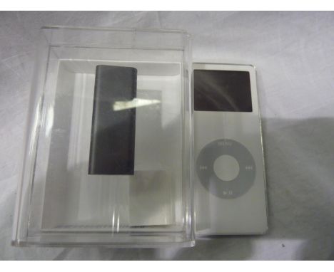 iPod Shuffle 2GB in black, iPod Nano 4GB in white and an iPod Shuffle 512MB. UK P&amp;P Group 2 (£20+VAT for the first lot an