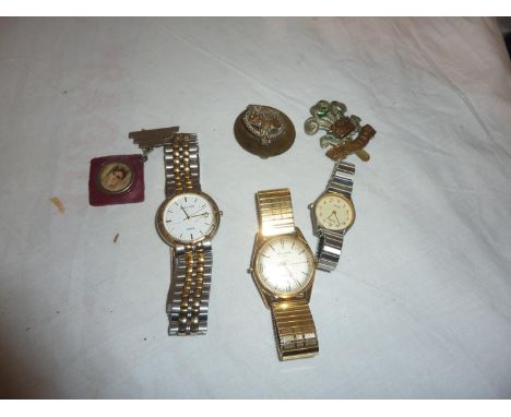 Military badges and wristwatches. UK P&amp;P Group 1 (£16+VAT for the first lot and £2+VAT for subsequent lots) 