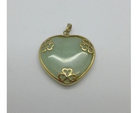 A 9ct gold mounted heart shaped jade pendant