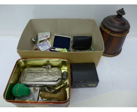 Coins and banknotes, a lighter, jewellery, a tea caddy and a cigarette case