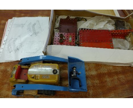A Meccano robot and a tin-plate bulldozer