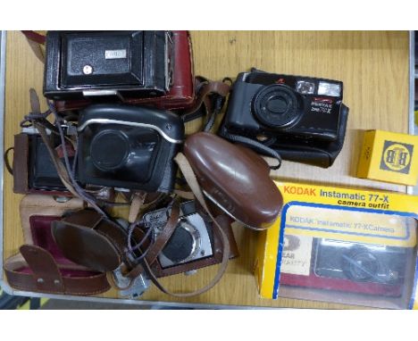 A collection of cameras including Nettar, Beirette, Balda and two Kodak, folding and Instamatic 77-X and a meter