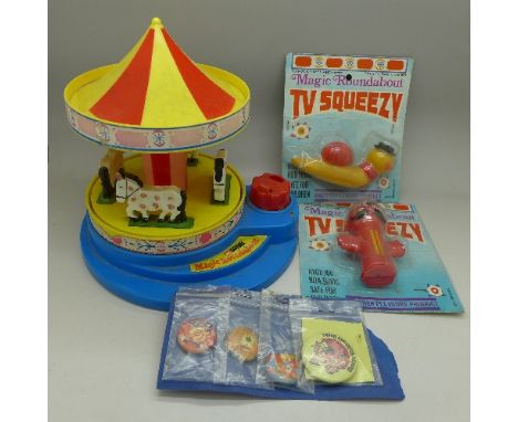 Two Magic Roundabout TV squeezy toys, a Corgi Magic Roundabout and four badges