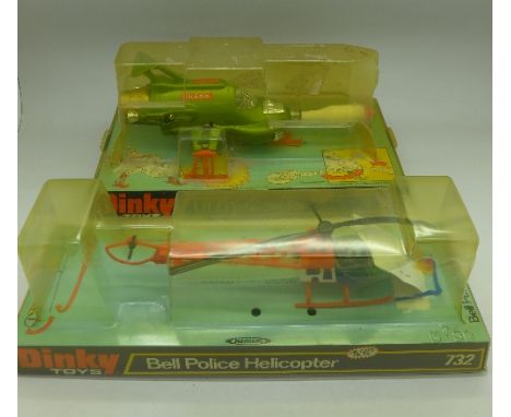 A Dinky Toys U.F.O. Interceptor, No. 351, and a Dinky Toys Bell Police Helicopter, No.732, both in bubble packs