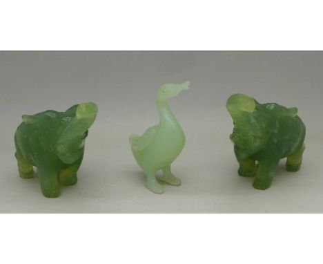 Two carved jade elephants and a jade duck