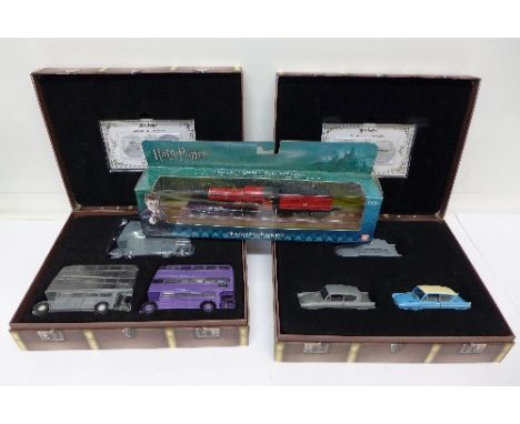 Two Harry Potter model sets, The Knights Bus and Mr. Weasley's Ford Anglia and a Corgi Hogwarts Express