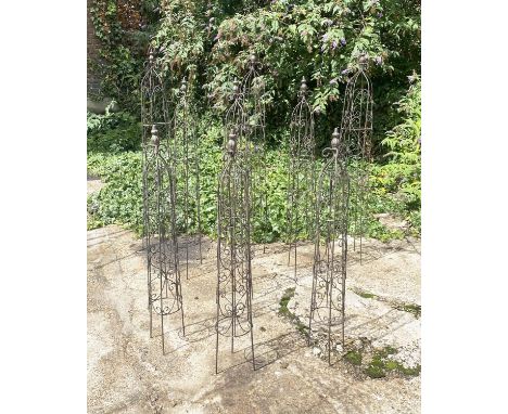 ARCHITECTURAL GARDEN OBELISKS, a set of nine, in metal, graduated sizes. (9) 