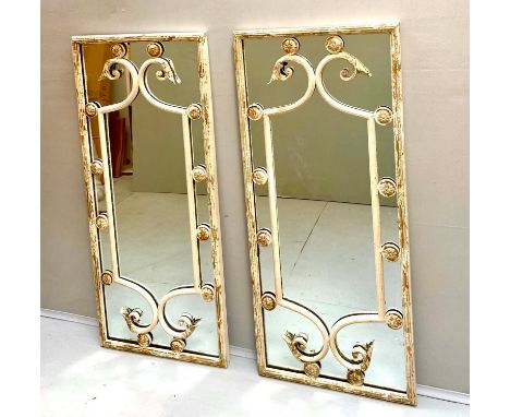 ARCHITECTURAL WALL MIRRORS, a pair, Italian style with distressed metal frames, 112cm H x 48cm W (2) 